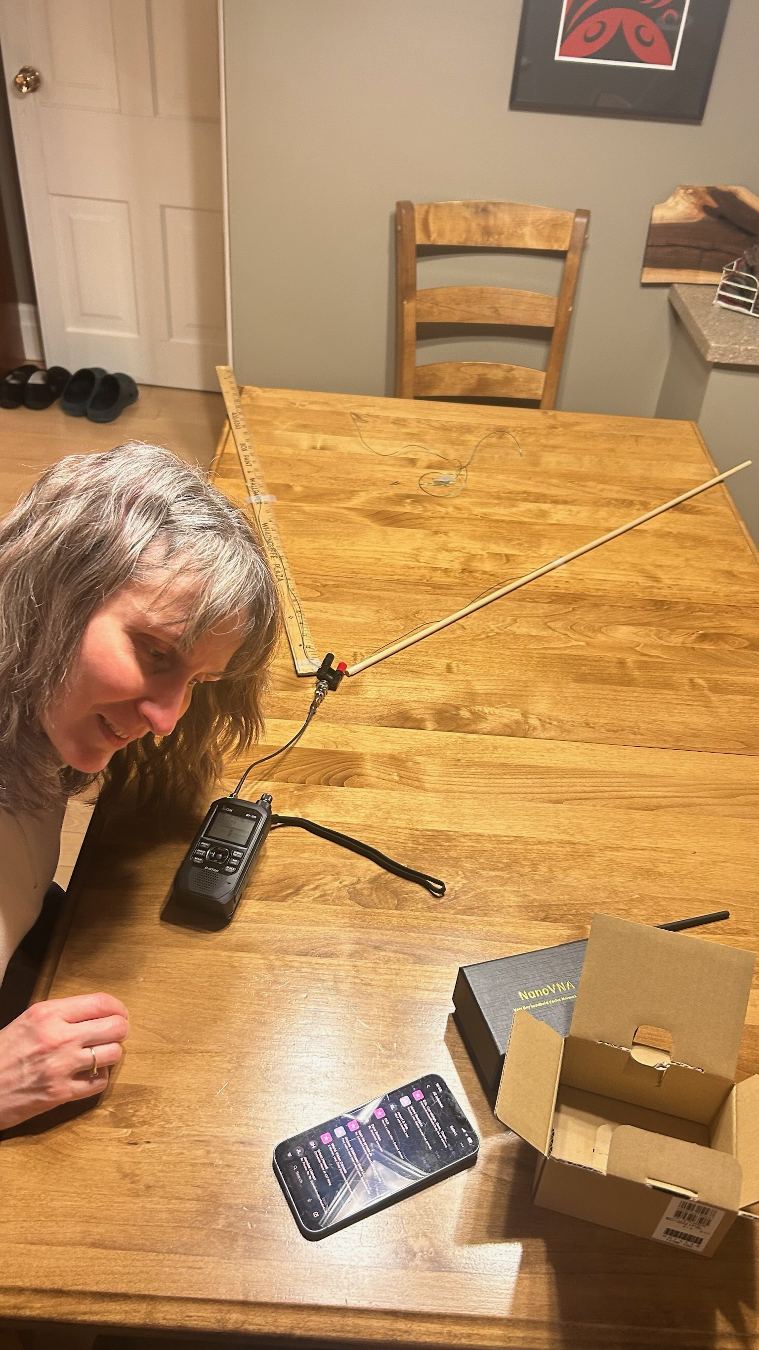 Homemade dipole antenna attached to handheld radio